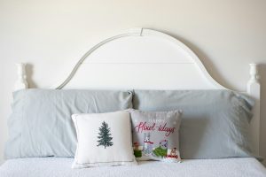 Bed with white headboard