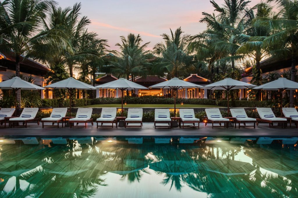 Lounge chairs beside a pool