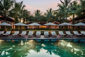 Lounge chairs beside a pool