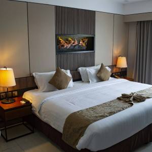 Hotel room with white bed linen
