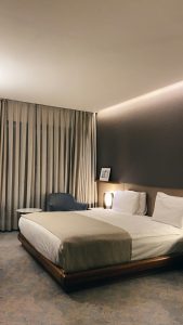 Hotel bed with grey pillows