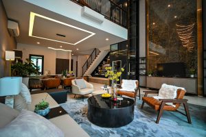 Open plan living room with leather armchairs